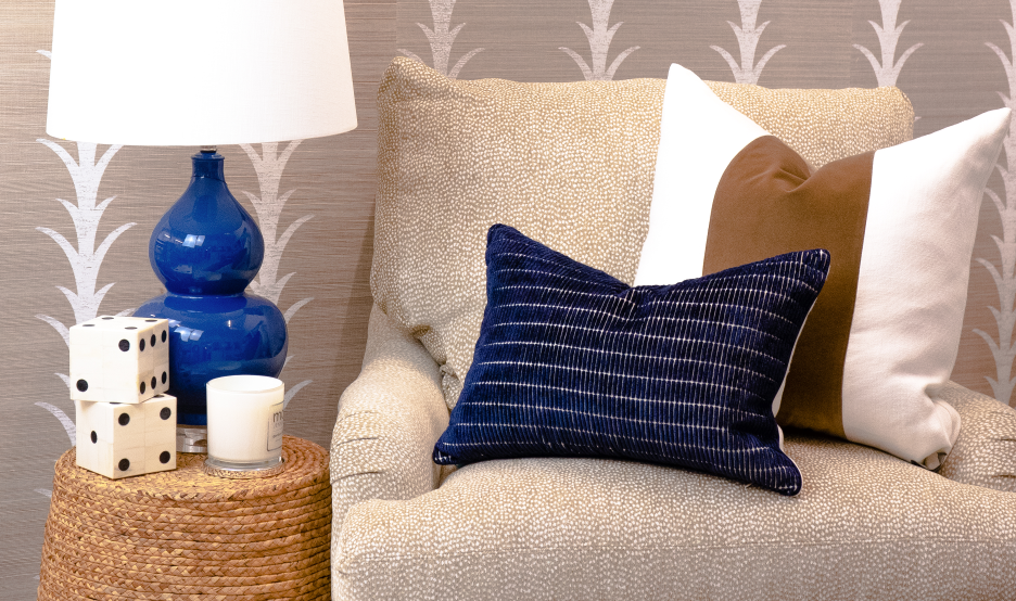 Cream-Colored Chair with Blue Lamp and Pillow